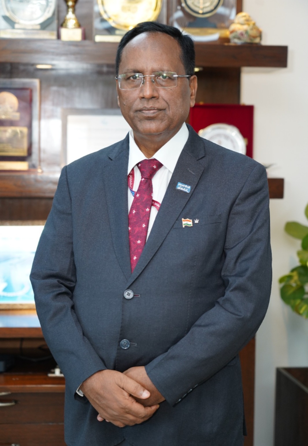 Portrait of NHPC Chairman & Managing Director R.K. Chaudhury at the corporate office, symbolizing leadership.